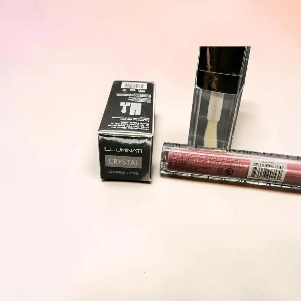 Illuminati Cosmetics Glowing Lip Oil in Crystal and Shimmer Lip Gloss in Calypso